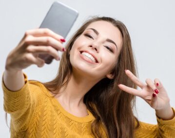 Woman smiling taking selfie